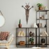 teal-alien-shaman-over-shelves-scaled