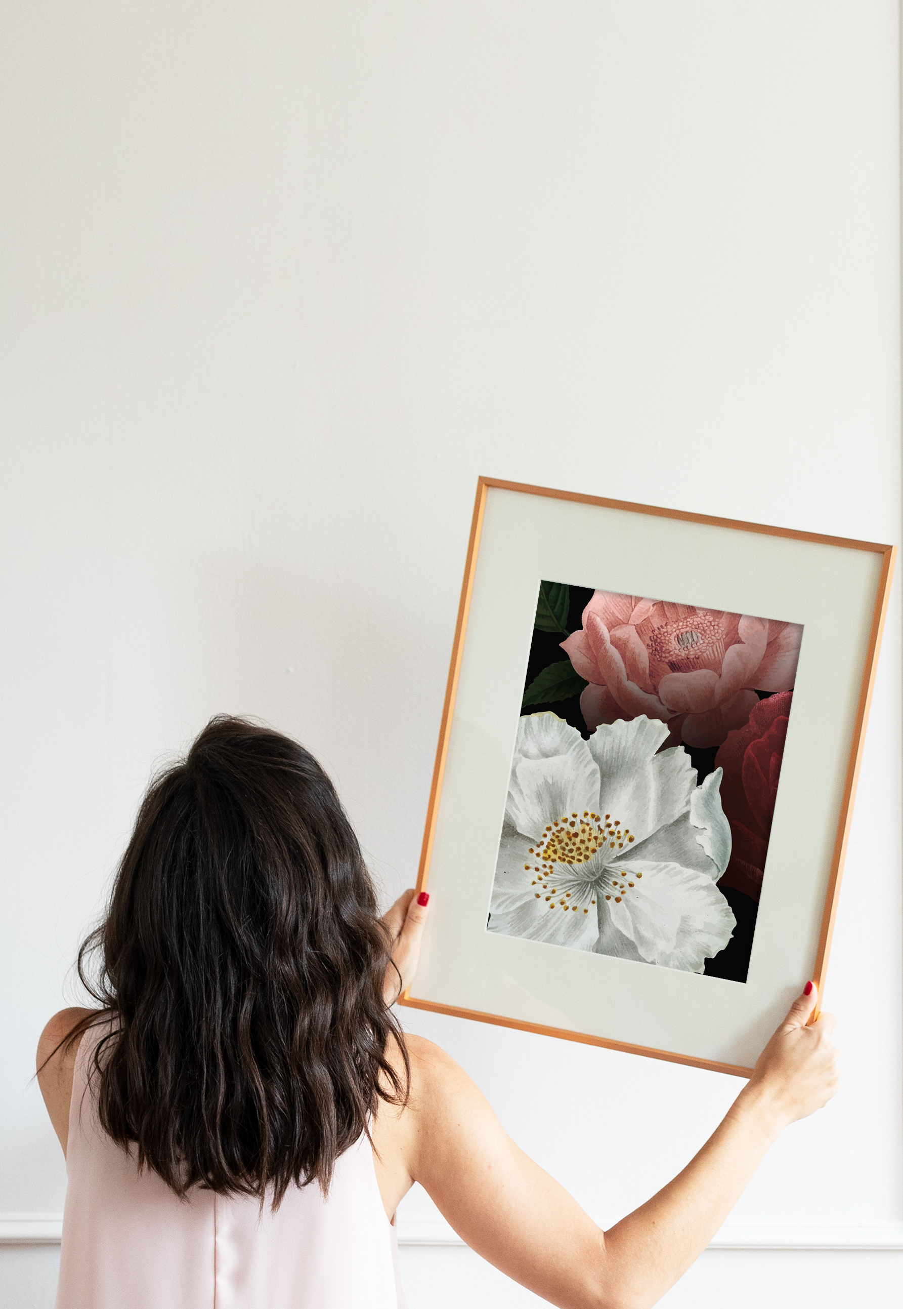 hanging the first photograph in a new art collection